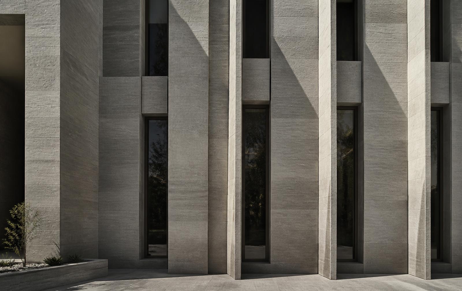 Contemporary Saudi limestone facade with vertical fins